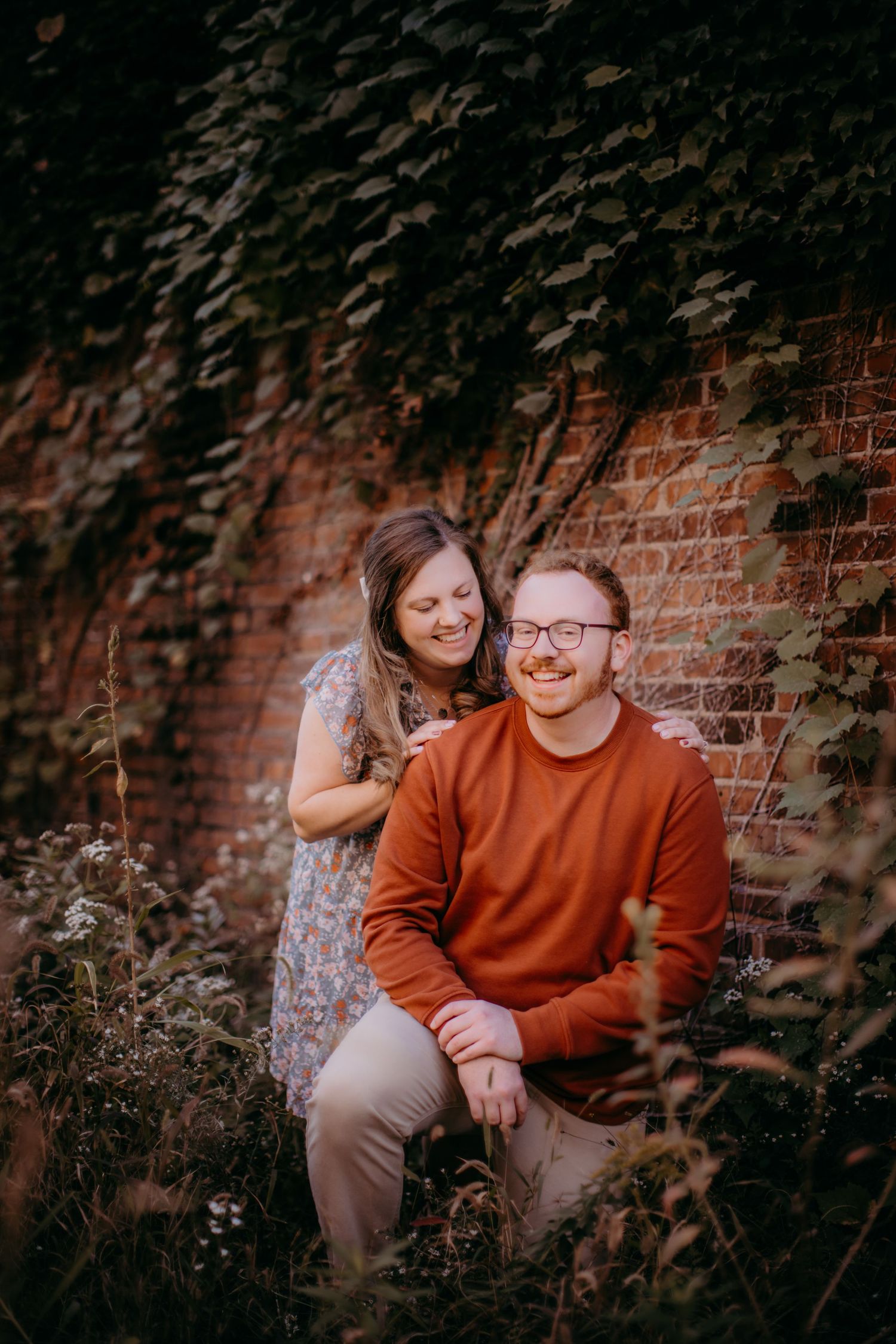 Candid laughter shared during an outdoor couples photography session.