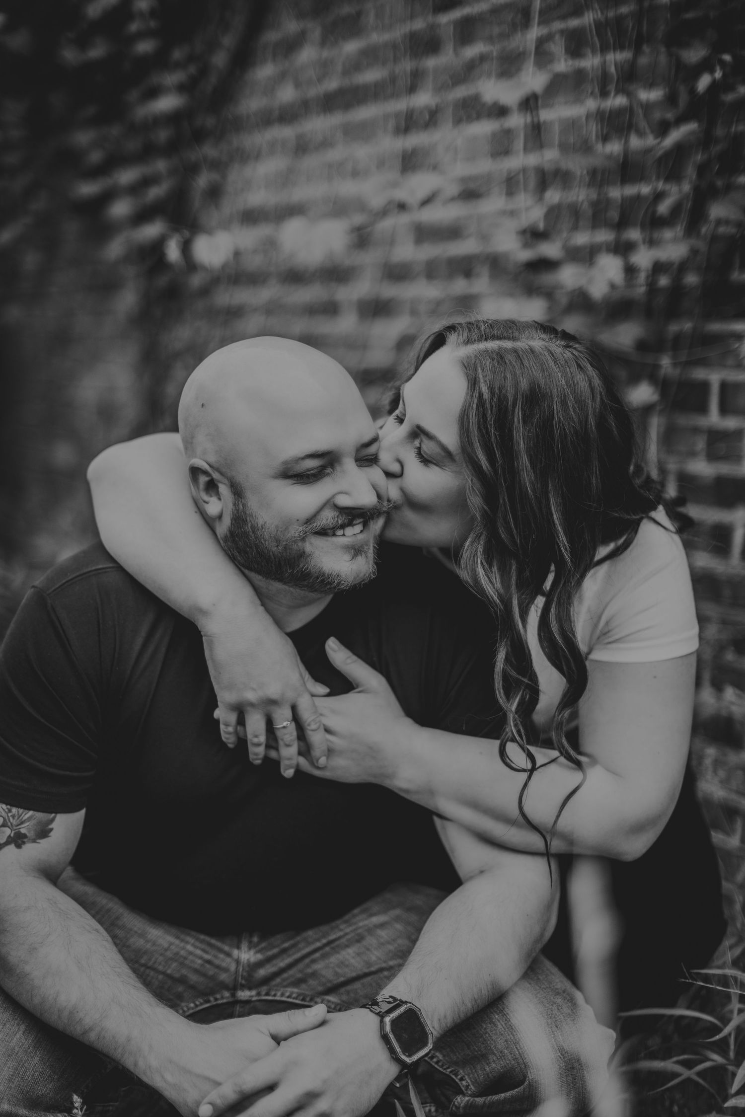 Black and white series capturing intimate moments between couple during engagement session.