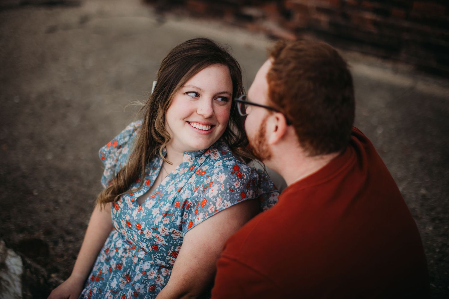 A couple shares an intimate moment during their outdoor portrait session.