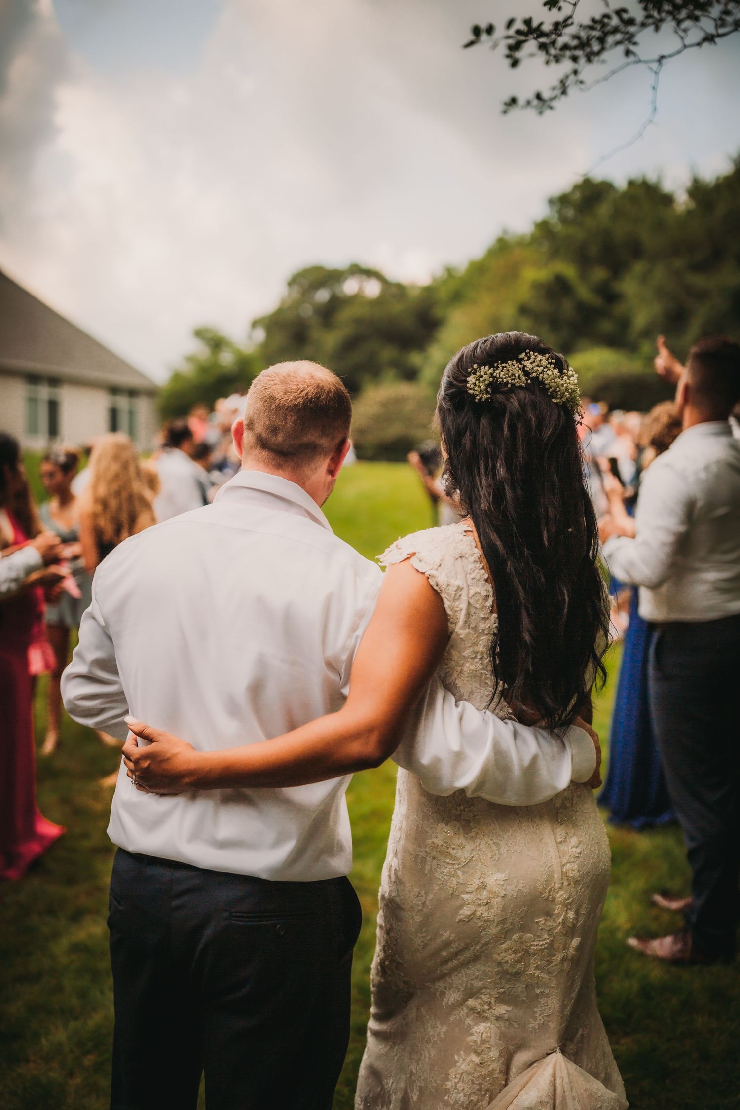 Couple sharing an intimate dance moment at outdoor wedding reception.