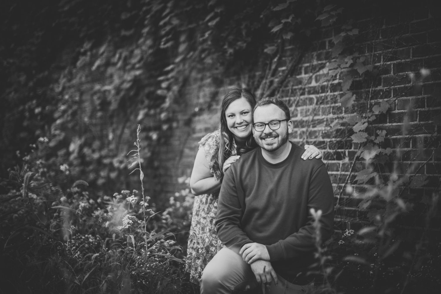 Artistic black and white photo capturing laughter and joy between two people.