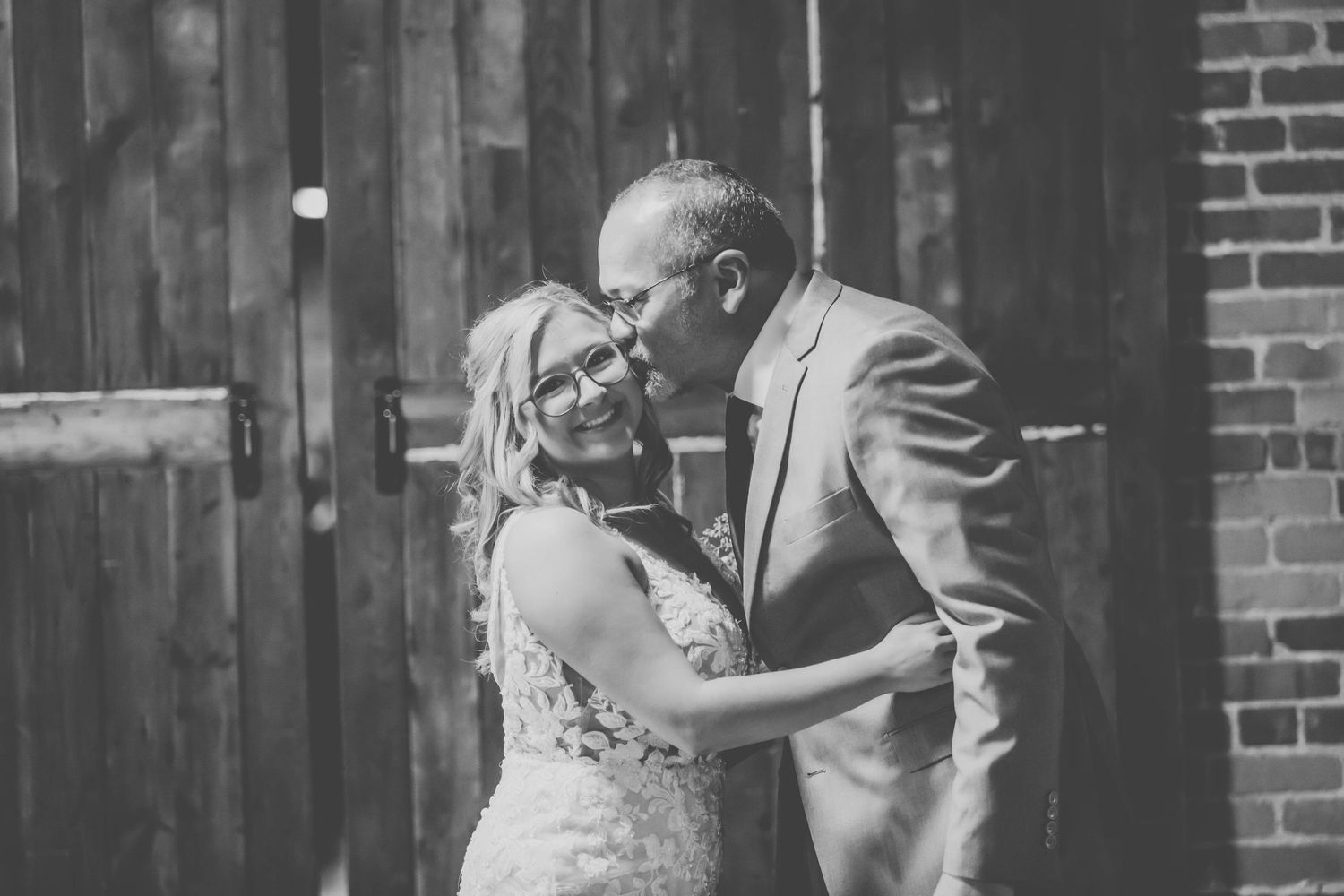 A romantic black and white portrait of a couple on their wedding day.