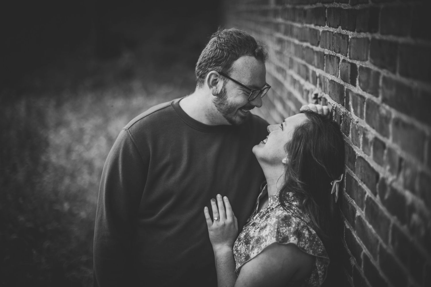 Monochrome image showing tender moments between a couple during their engagement session.