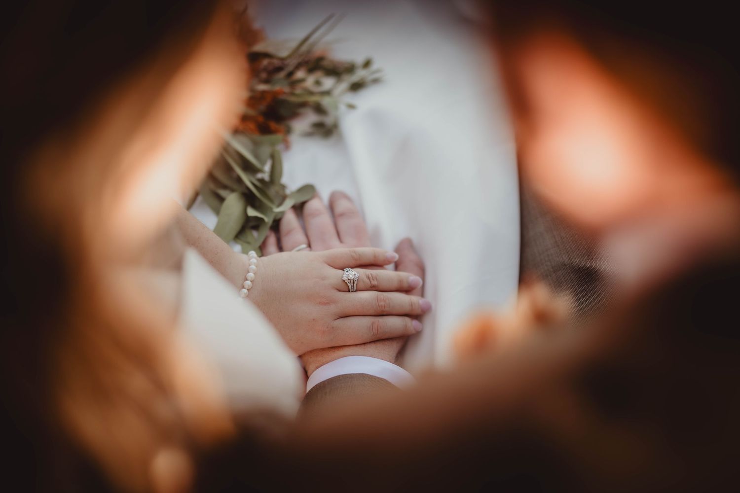 Artistic close-up wedding photo capturing intimate details and emotions.