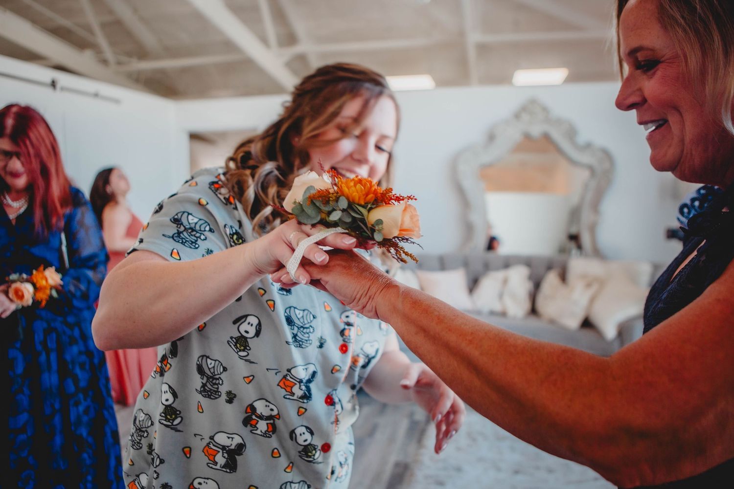 Panoramic view of an emotional first look scene at a modern wedding venue.