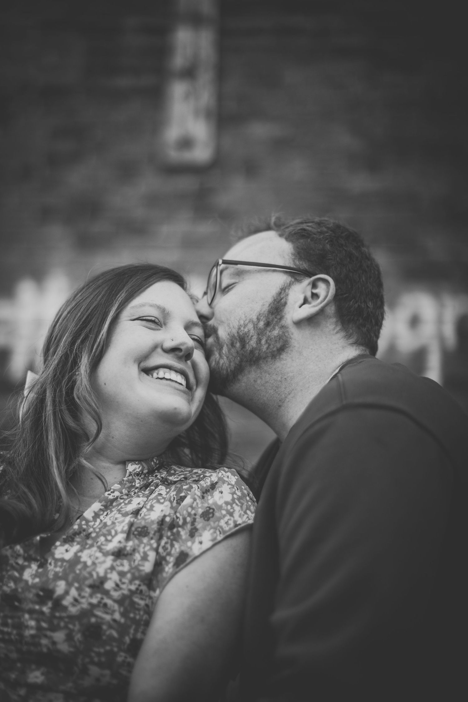 Black and white intimate portrait of a couple sharing a romantic moment together.