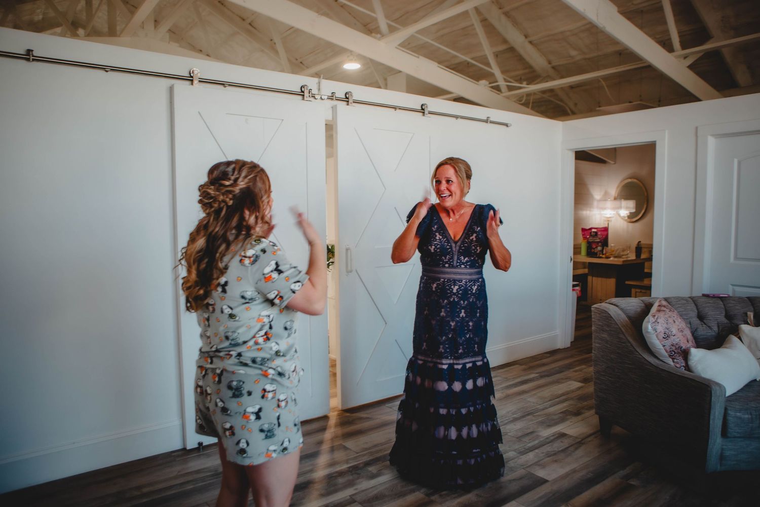 Candid sequence of wedding first look reactions in a bright indoor space with white walls.