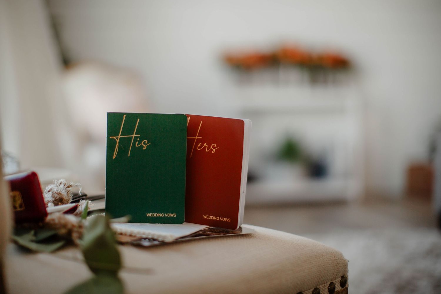 Two small books titled 'His' and 'Hers' displayed on beige surface.