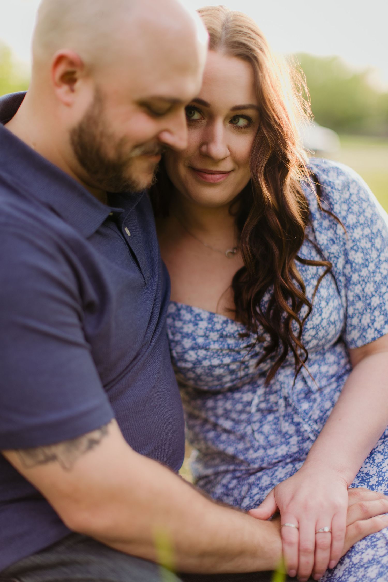 A close-up portrait of a couple sharing an intimate moment during their outdoor photoshoot.