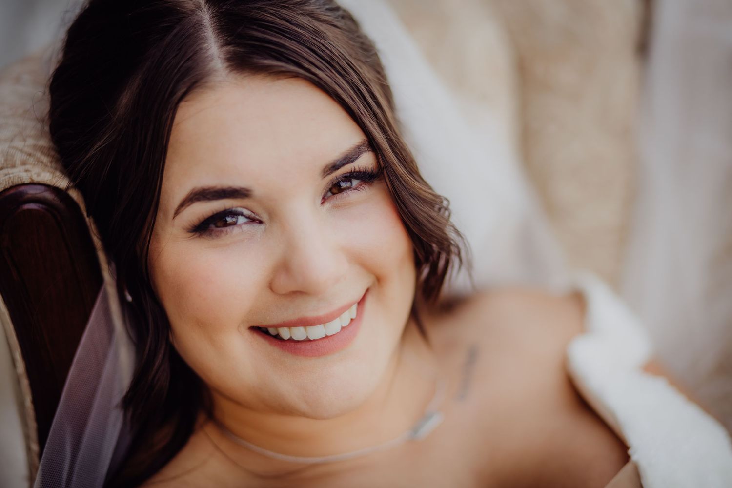 Close-up bridal portrait with soft lighting and romantic veil.