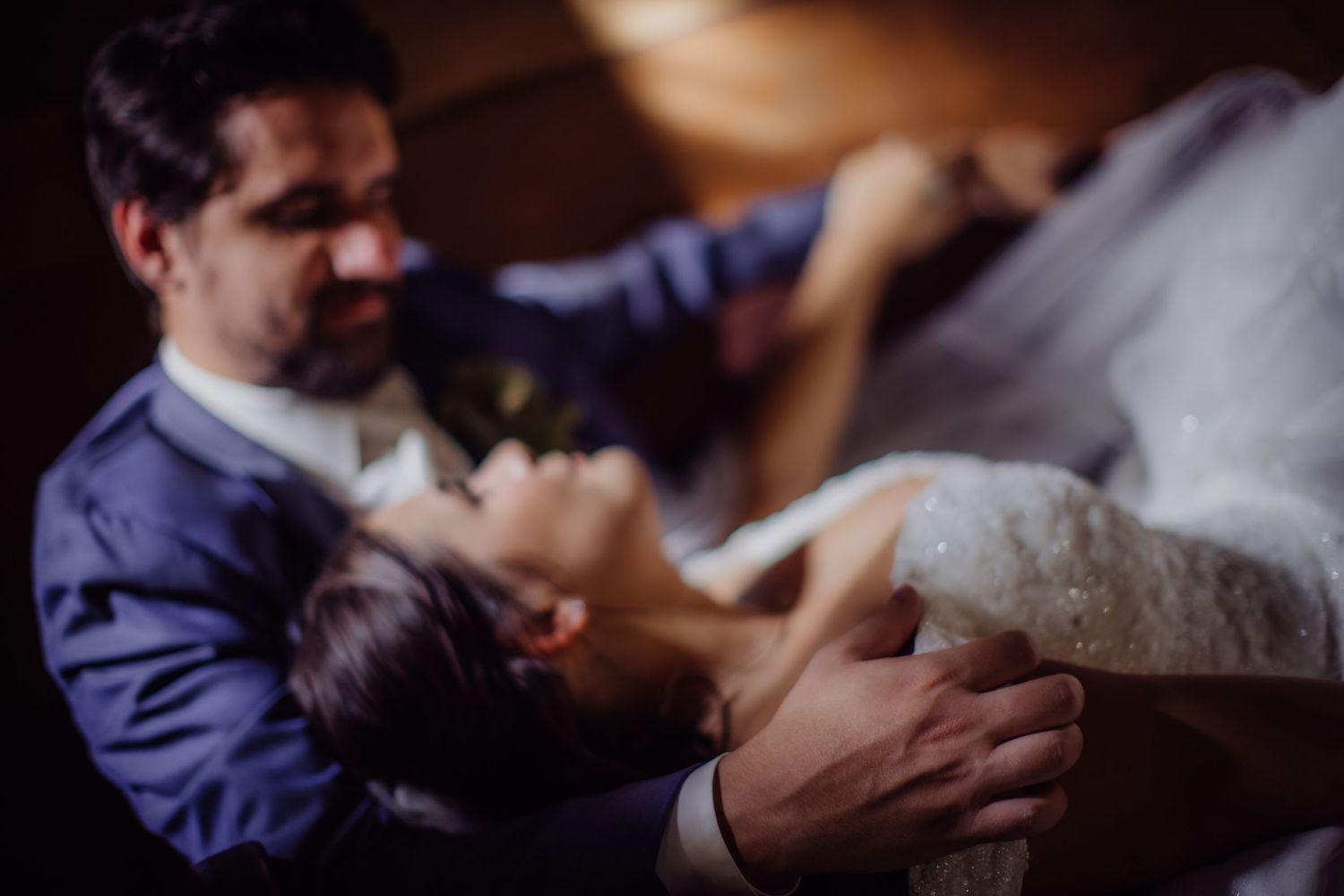 Romantic wedding photography with soft focus and intimate lighting.