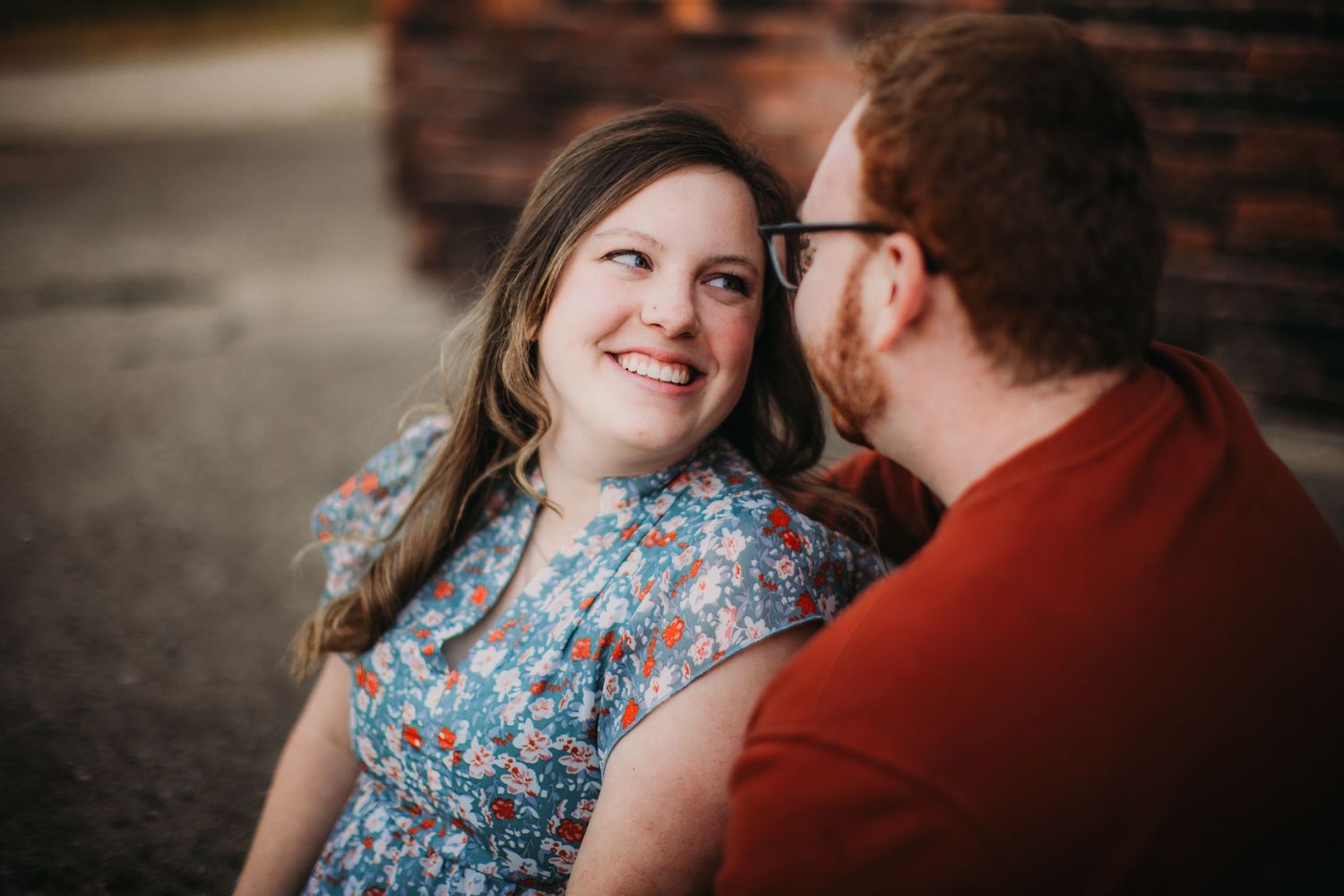 A couple gazes at each other lovingly during their photoshoot.