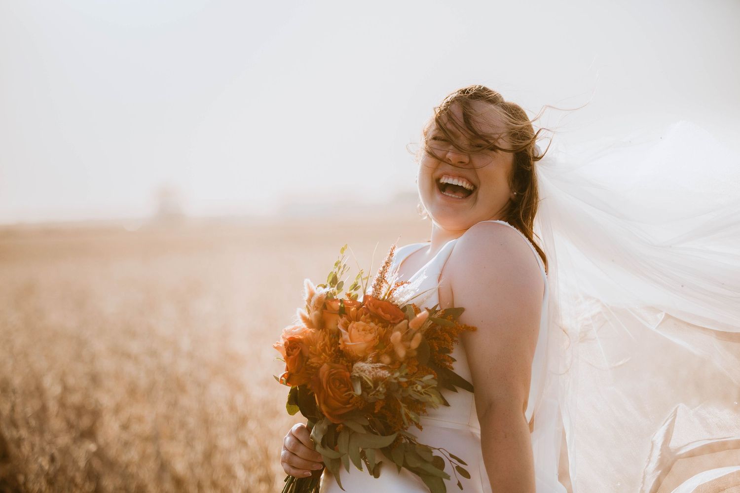 Joyful wedding sequence captured in natural light with flowing veil and autumn bouquet.