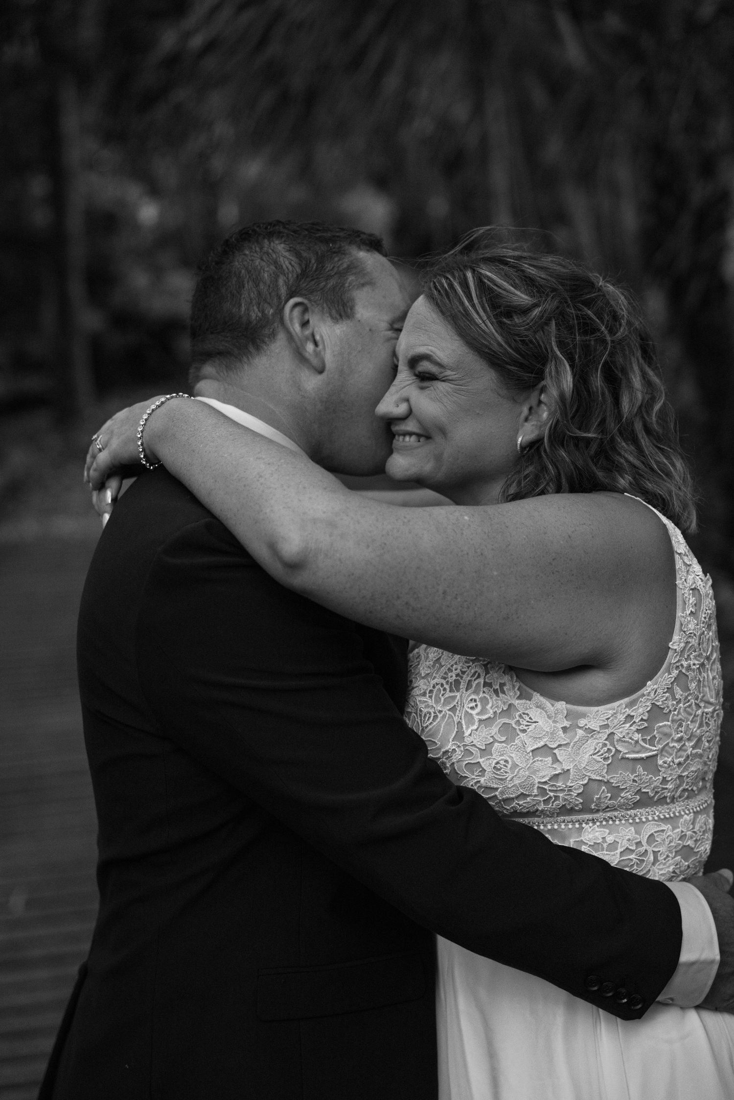 Black and white sequence of romantic wedding couple embracing and sharing an intimate moment during their photoshoot.