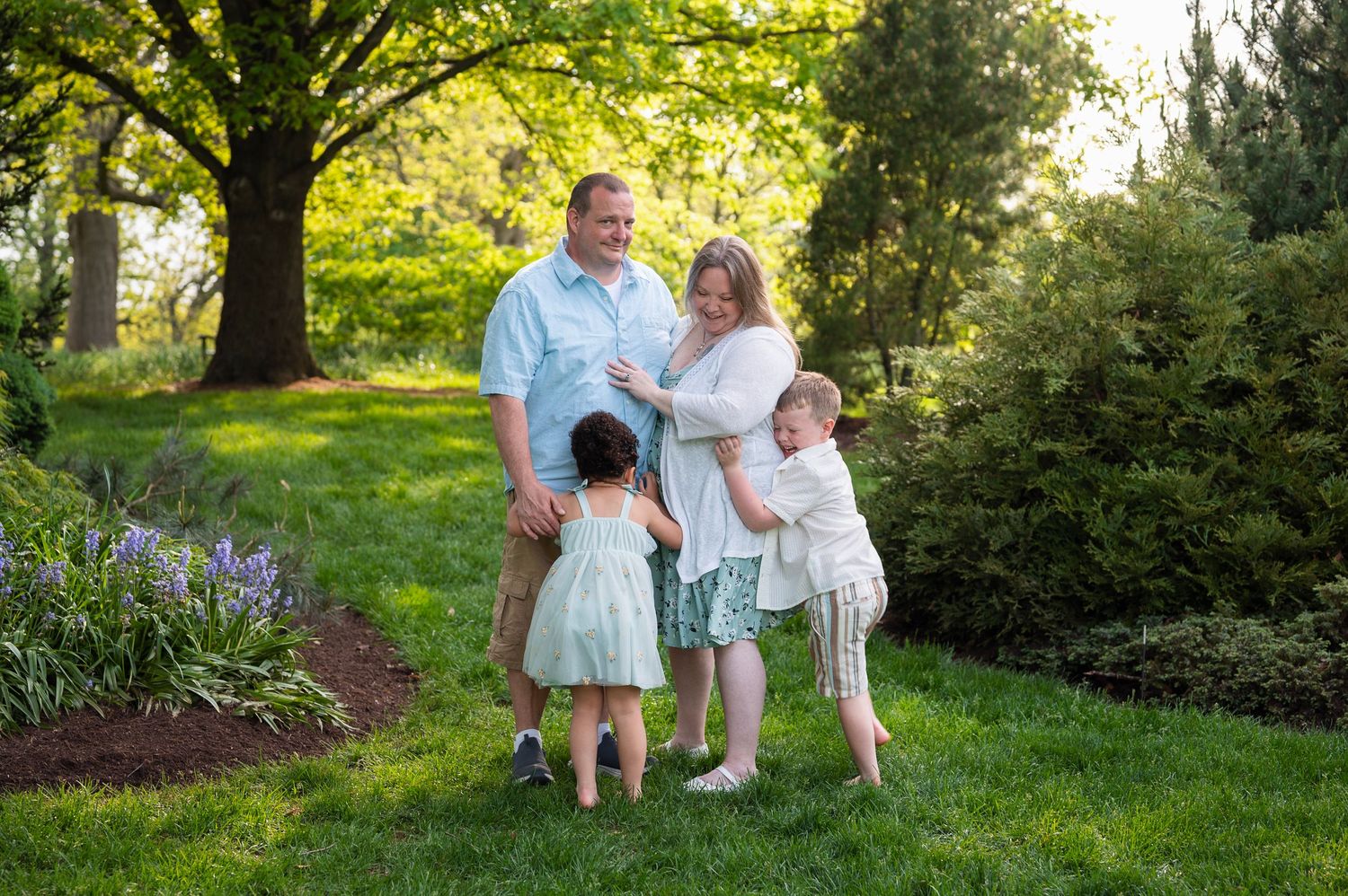 Giggles and bear hugs during a spring mini session