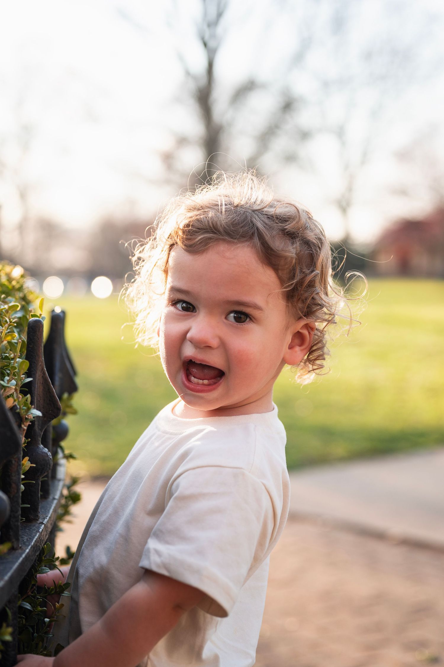 Candid close-up of toddler smiling at sunset during a spring photo session in Westerville