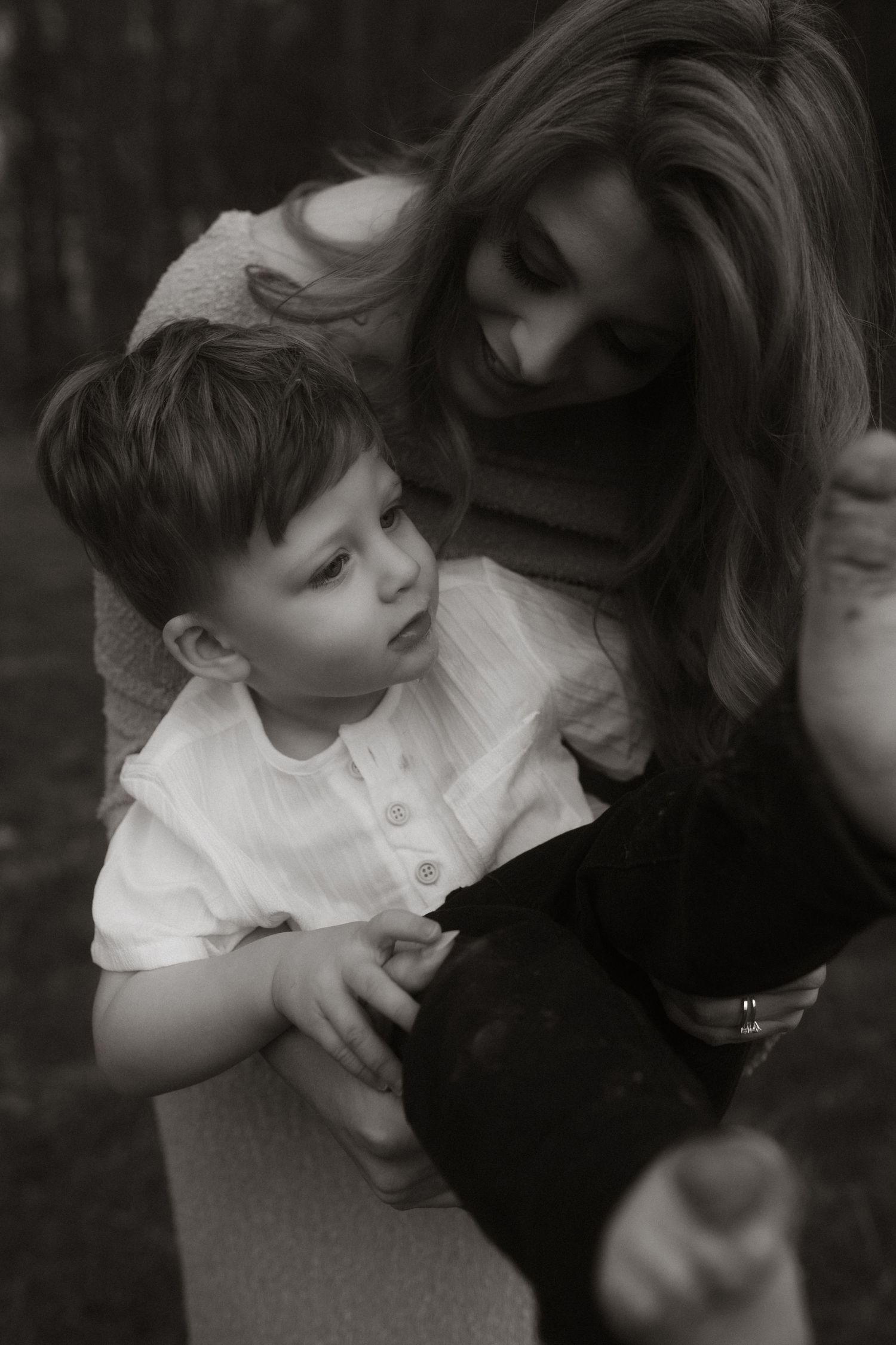 An intimate black and white family portrait moment.