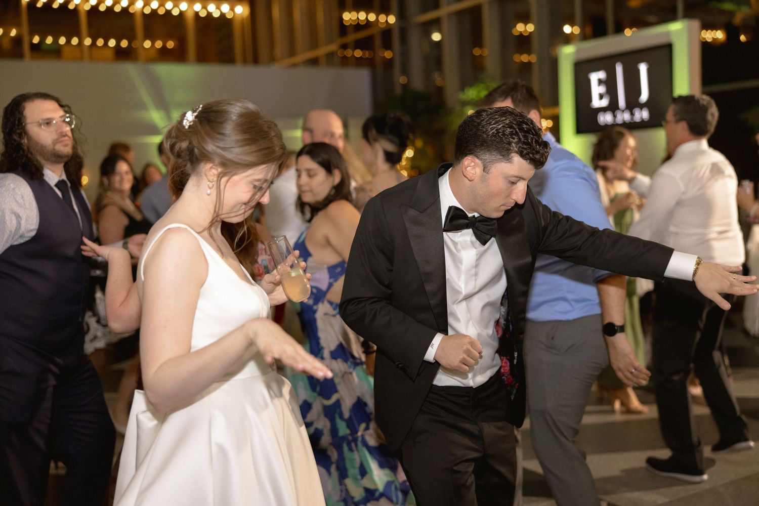 Newlyweds dancing and enjoying themselves at their wedding reception.