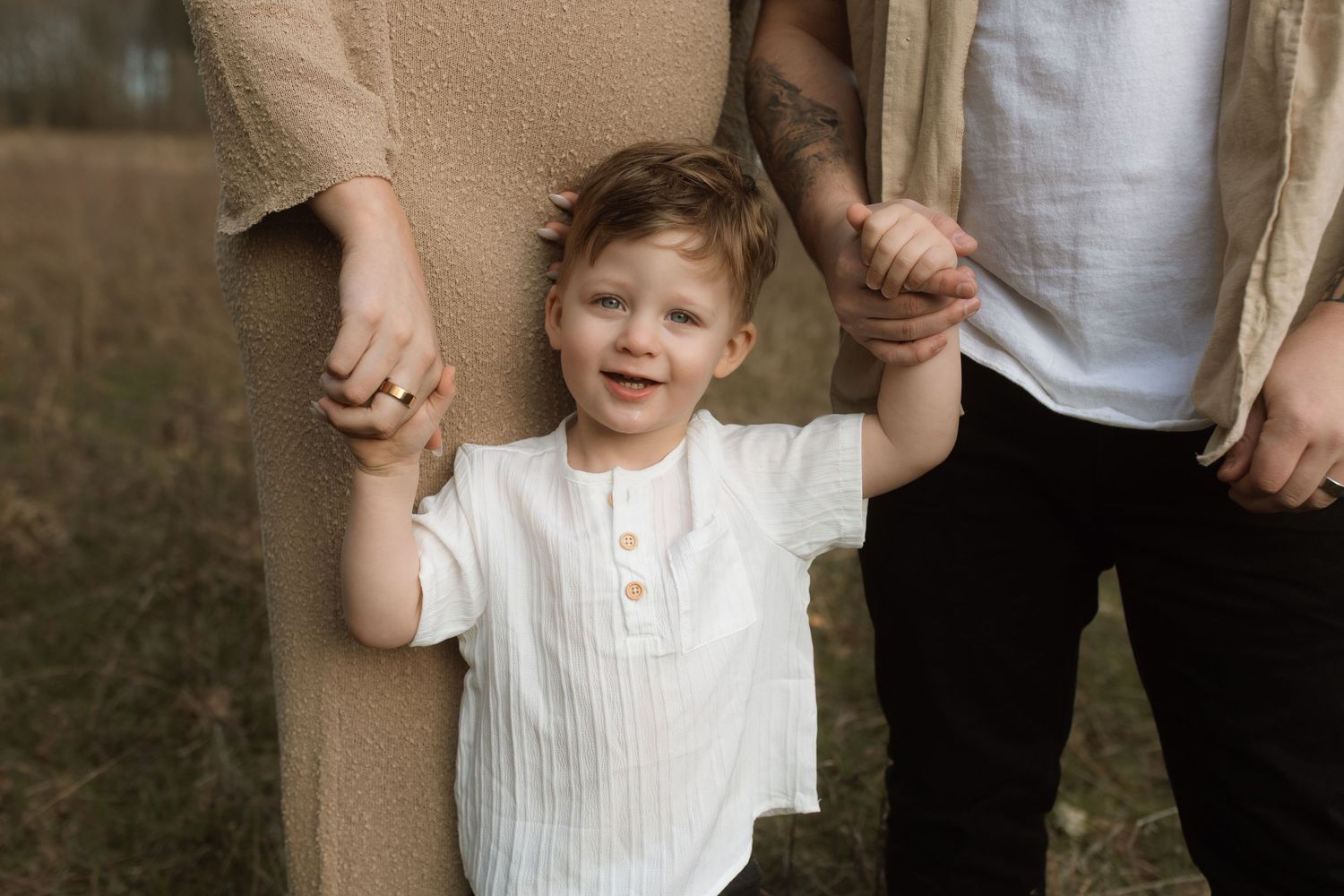 A joyful family moment captured outdoors in natural lighting.