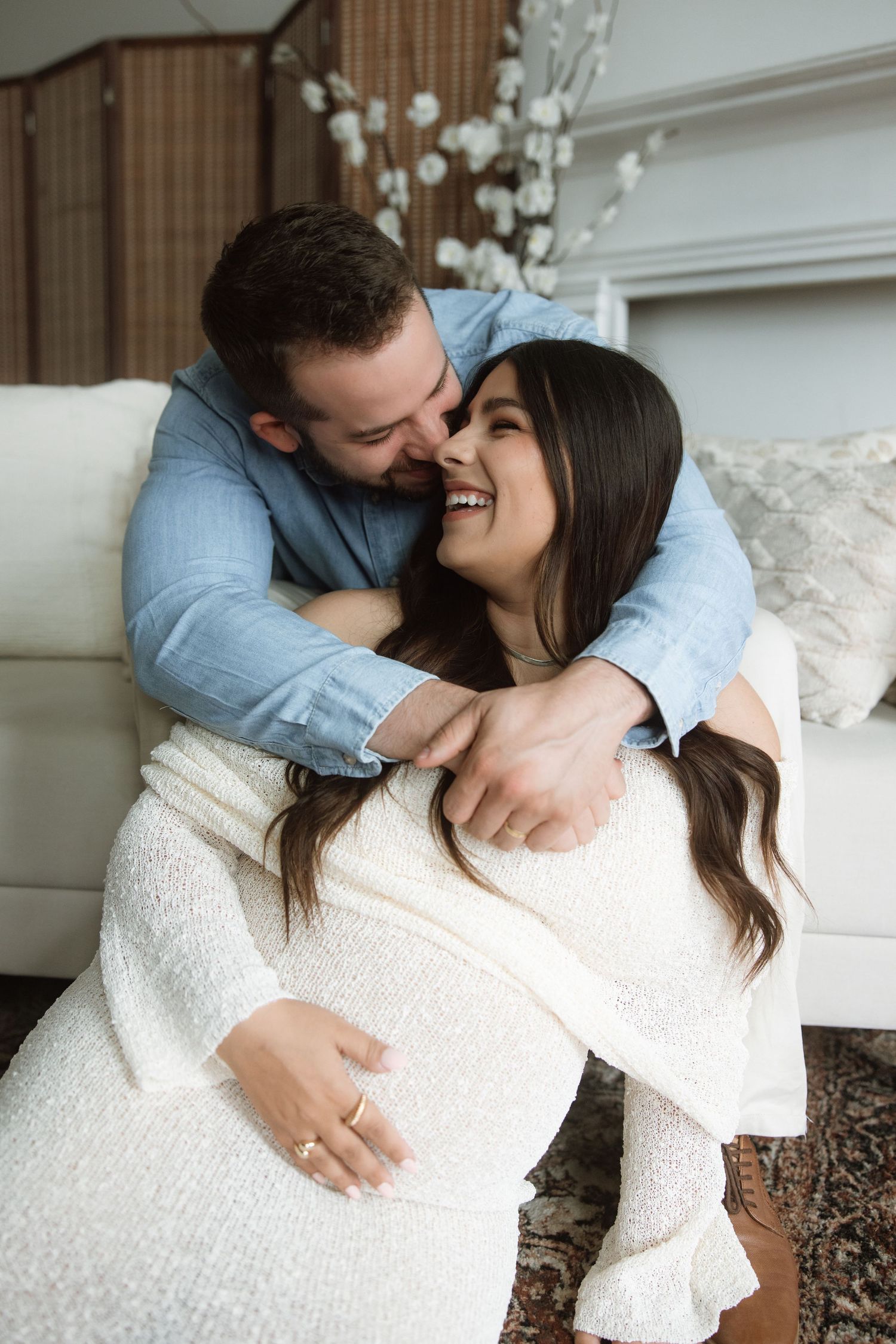 A couple in casual attire share intimate embraces and kisses in a series of romantic portrait photographs.
