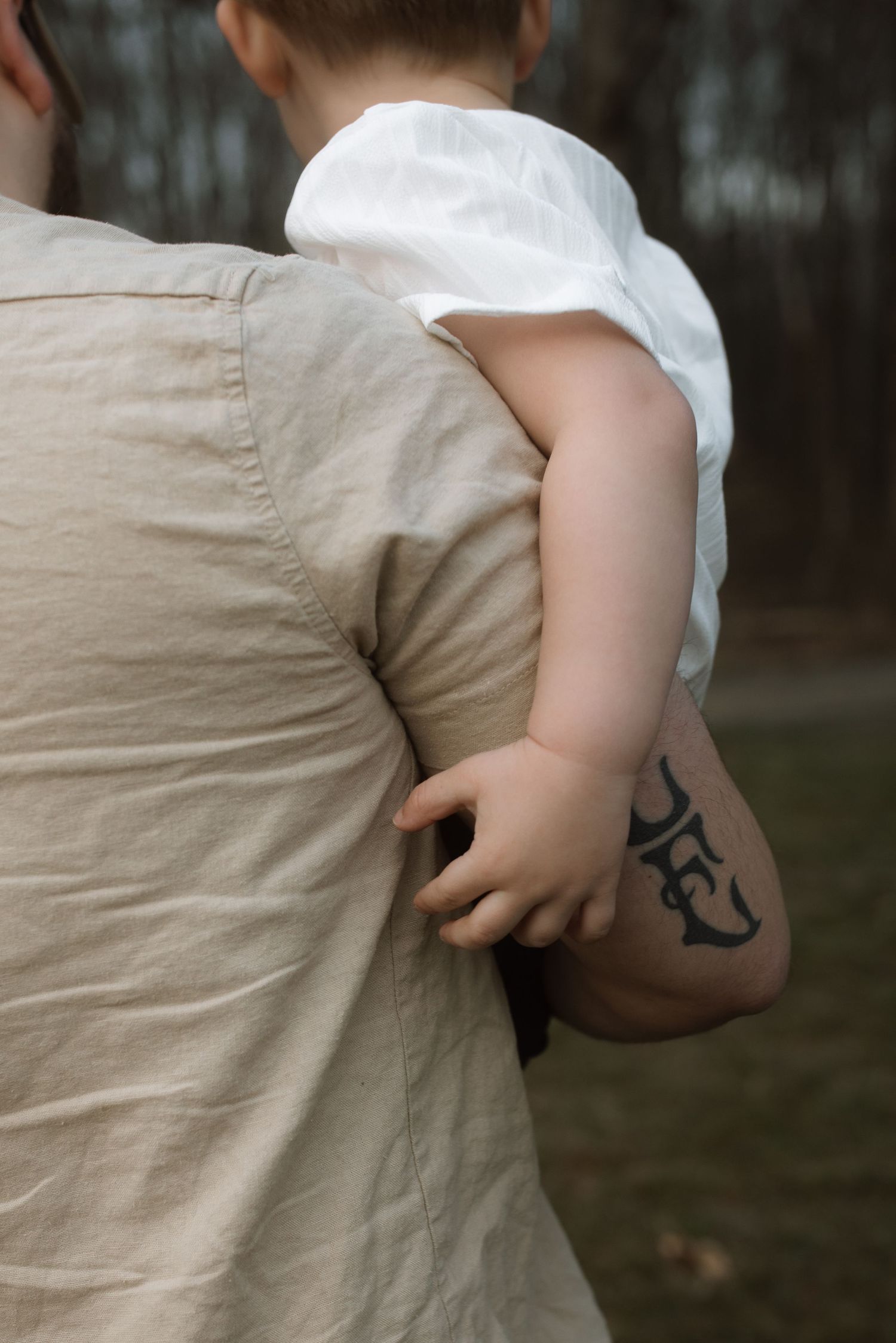 Close-up of a child being held.