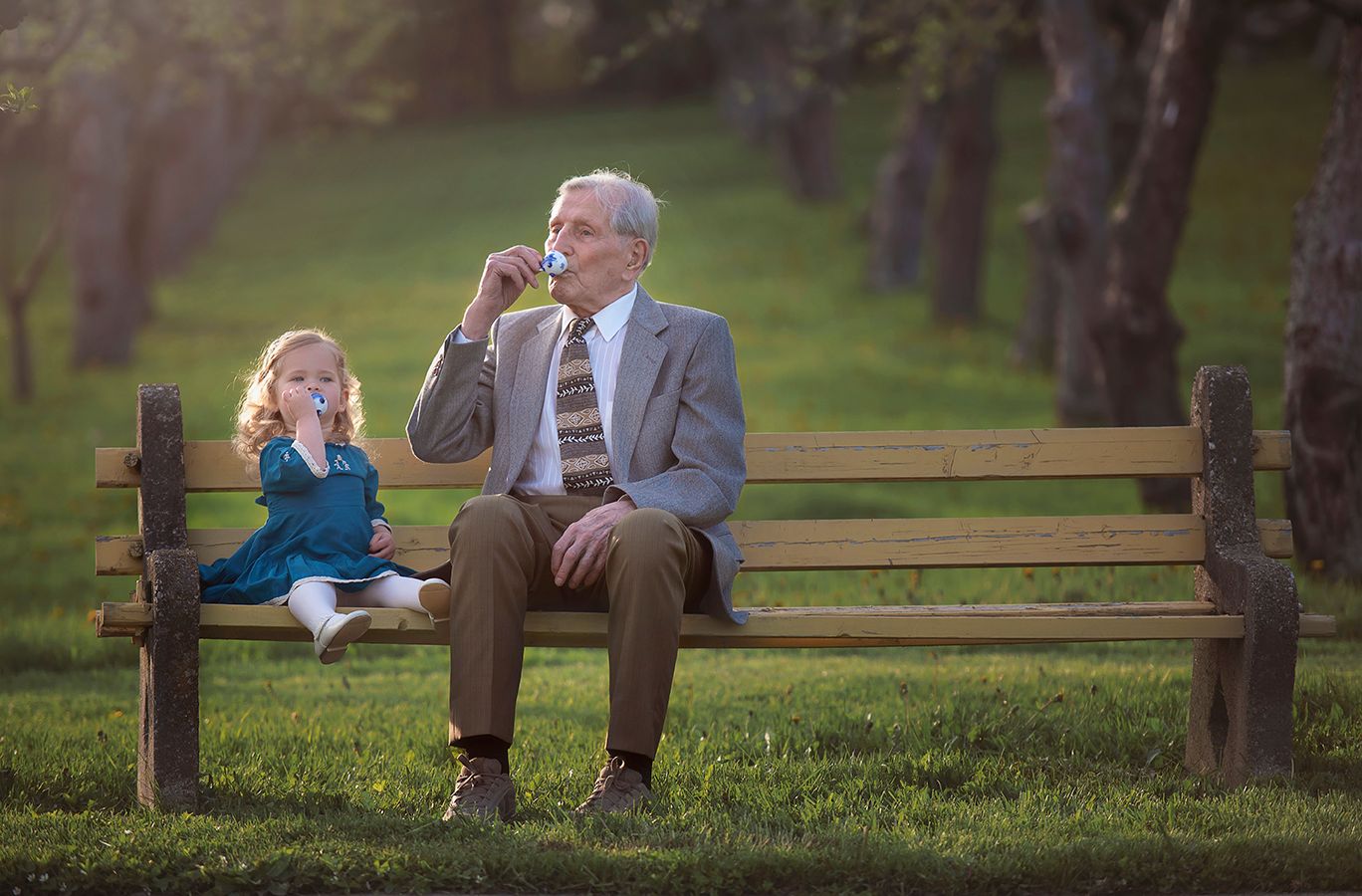Heirloom Portraits of Great-grandfather having a tea time in Wickham Park with one of his great-grand-children.