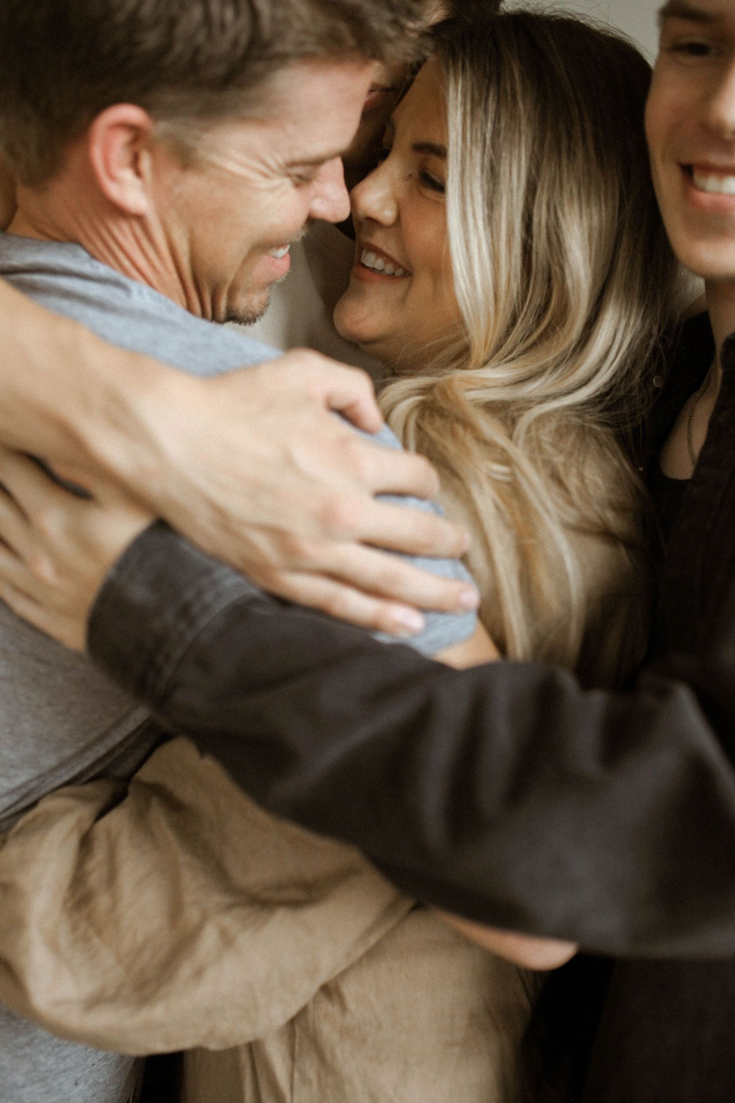 Intimate moment captured between family sharing warm embrace.