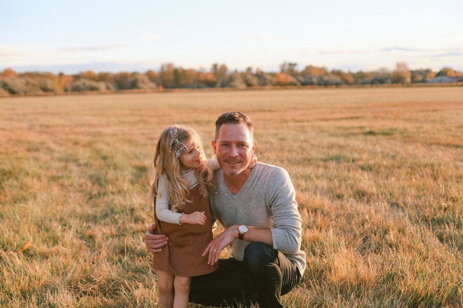 Candid outdoor portrait in autumn field.