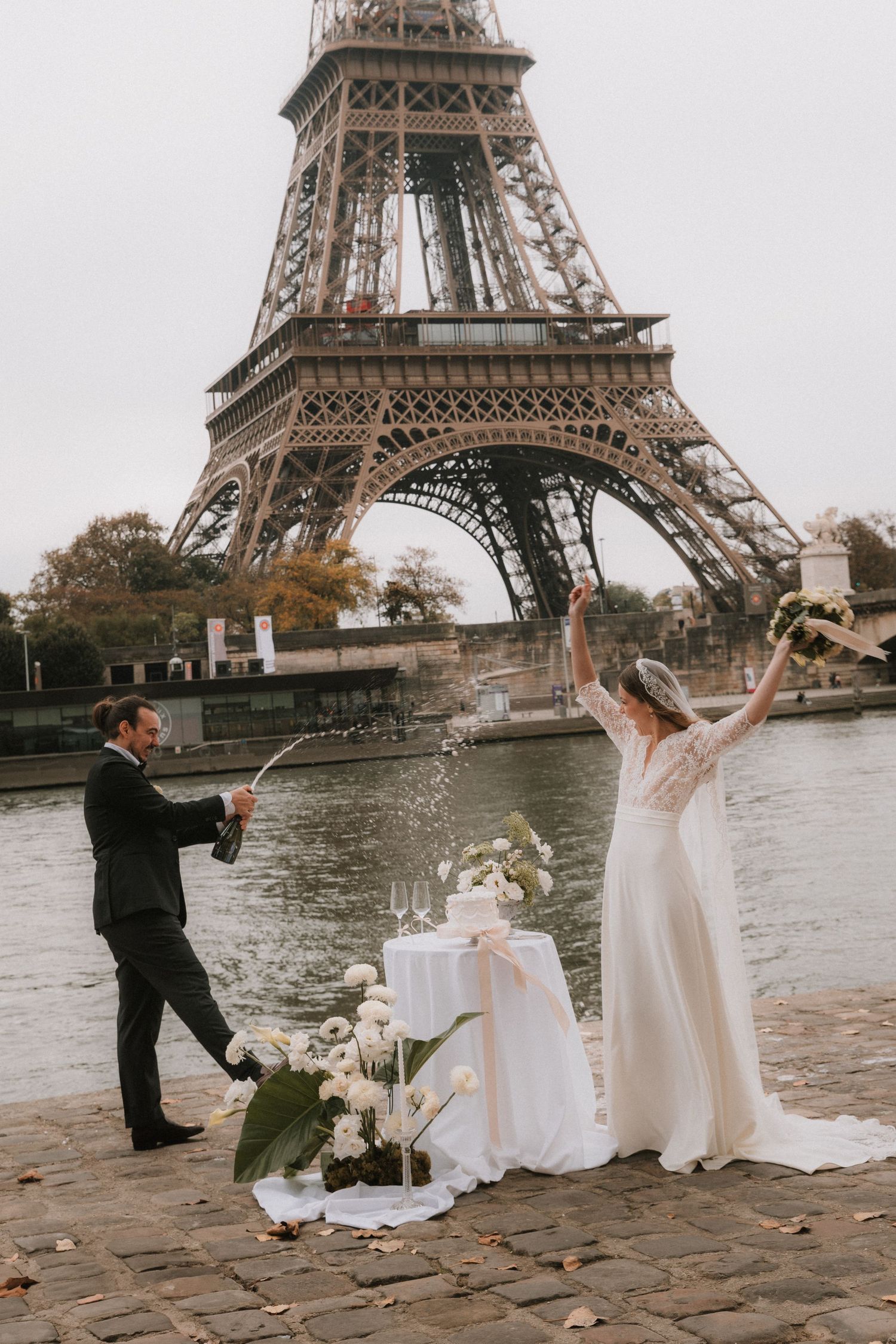 A romantic wedding photoshoot with the iconic Eiffel Tower as backdrop in Paris during golden hour.