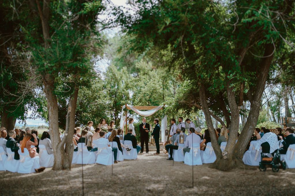 Bride and groom exchanging vows during a romantic outdoor wedding ceremony in Banff | Calgary wedding photographer.