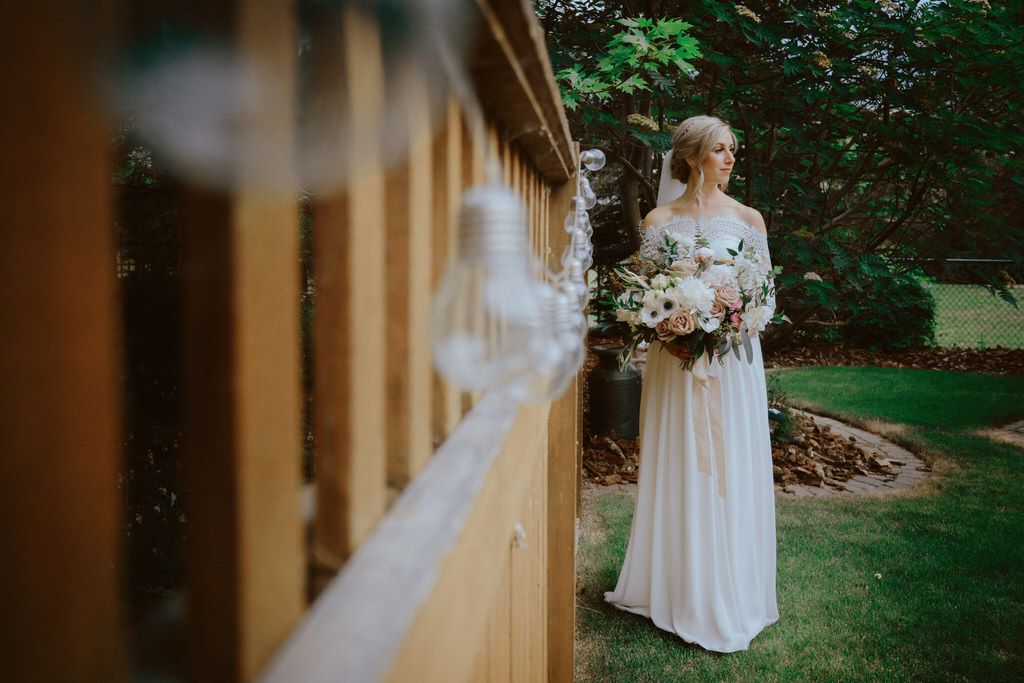 Elegant bridal portrait with soft natural light and lace wedding gown details | Calgary wedding photographer capturing timeless beauty.