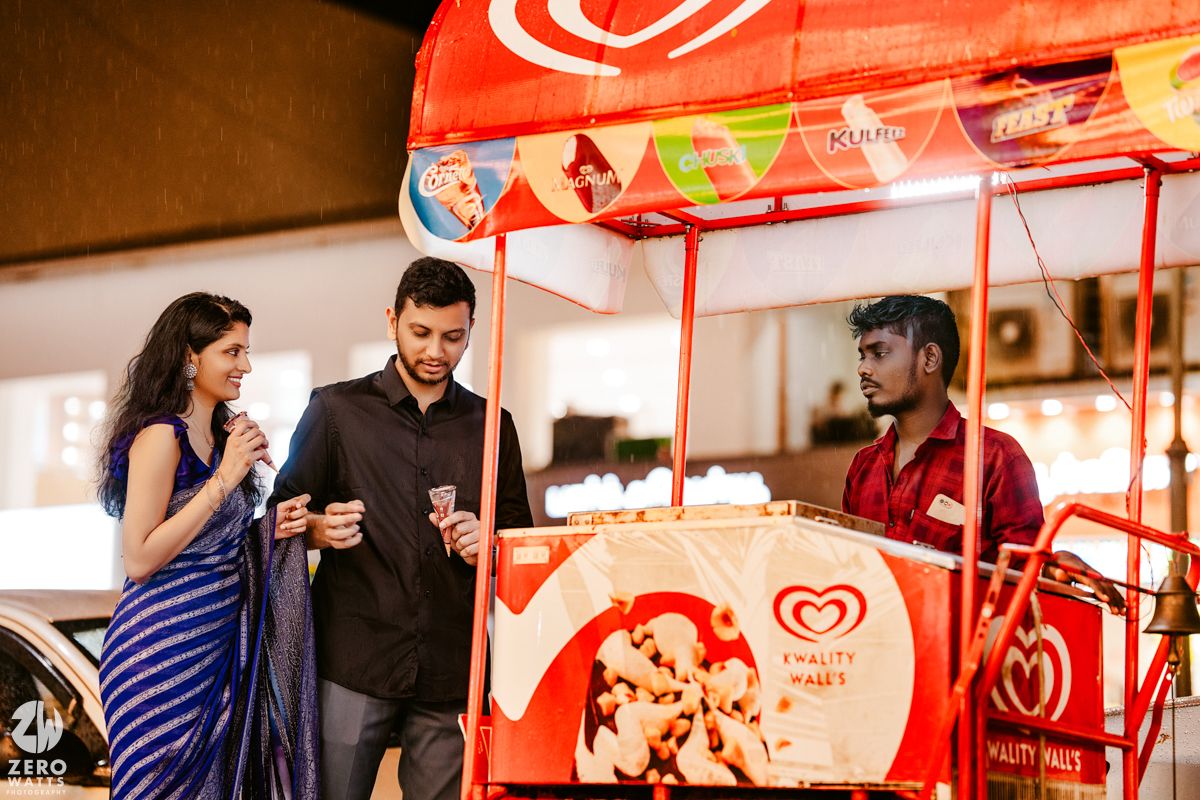 Casual gathering with red and white decor at an indoor venue.