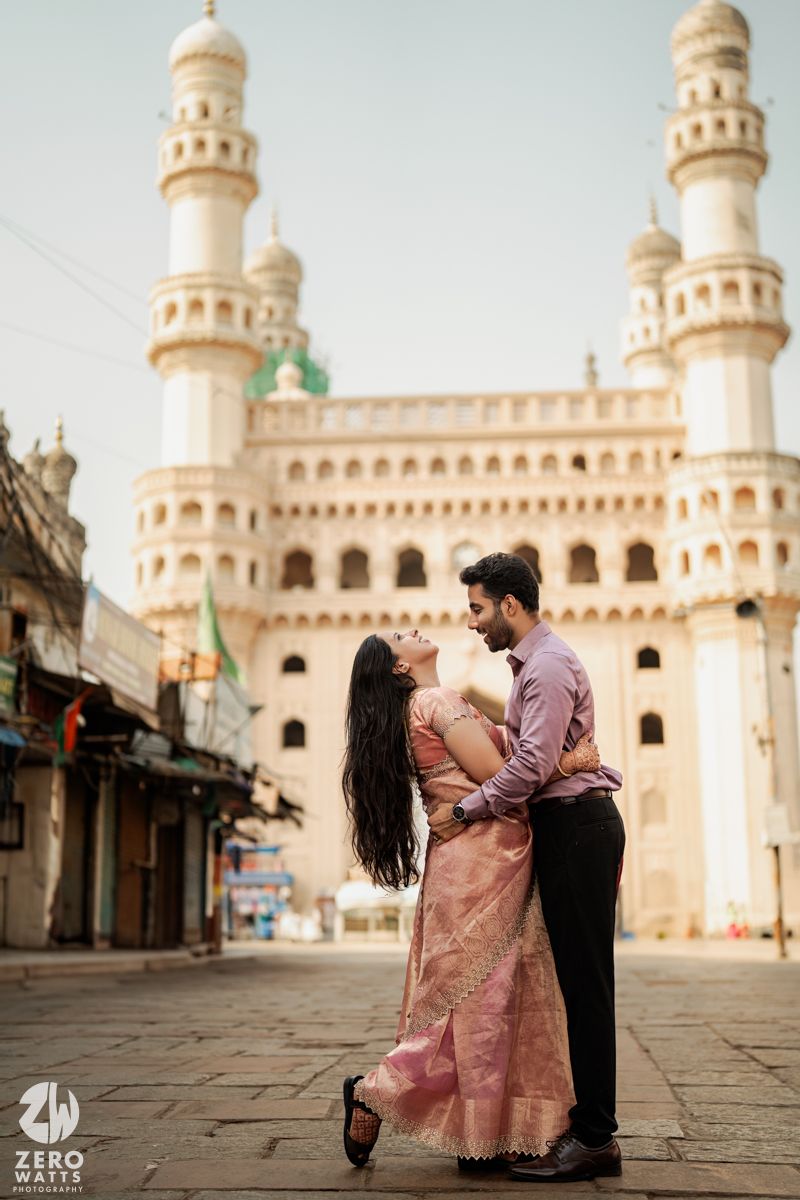 Romantic moment captured in front of historic Charminar monument in Hyderabad.