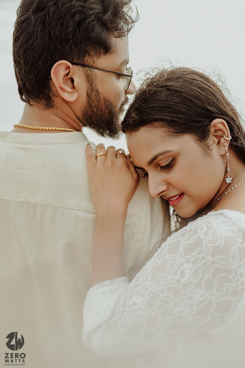 Close-up shots of a couple sharing tender intimate moments in white attire.