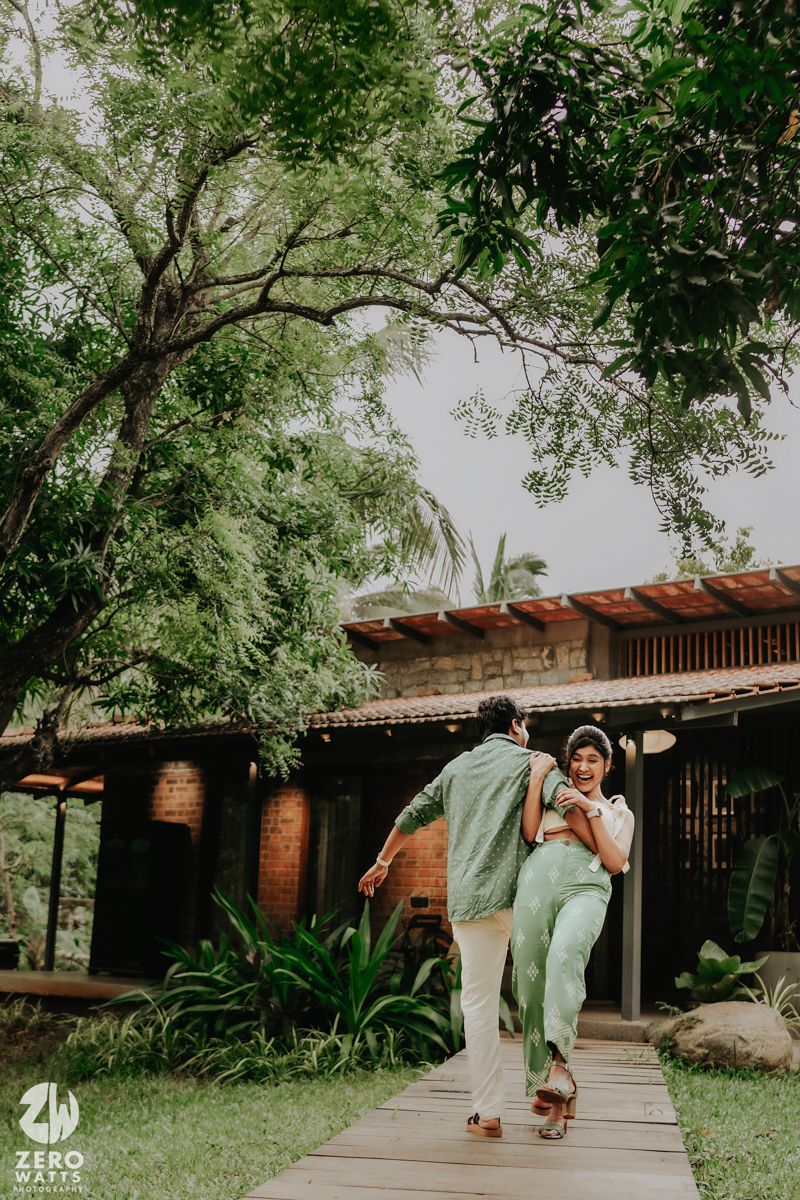 A sequence showing a figure practicing martial arts moves outdoors in front of a rustic building with lush greenery.