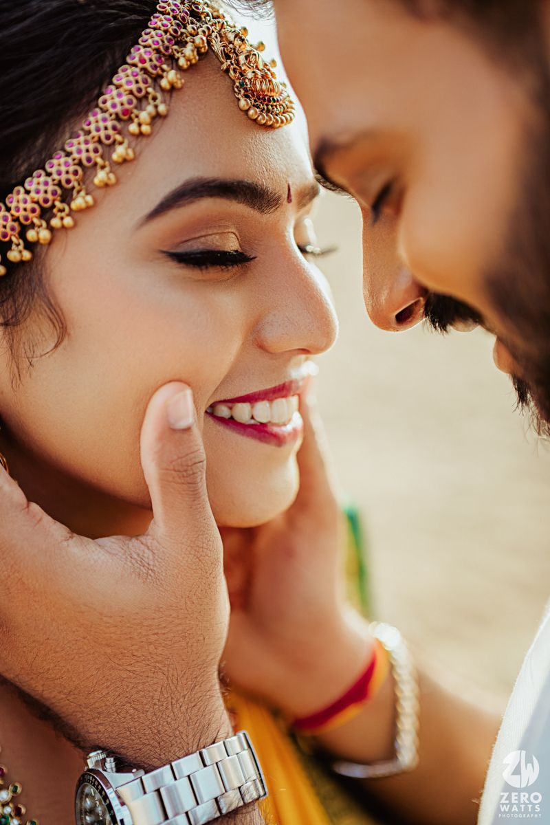 Close up of traditional South Indian bridal makeup with gold jewelry.