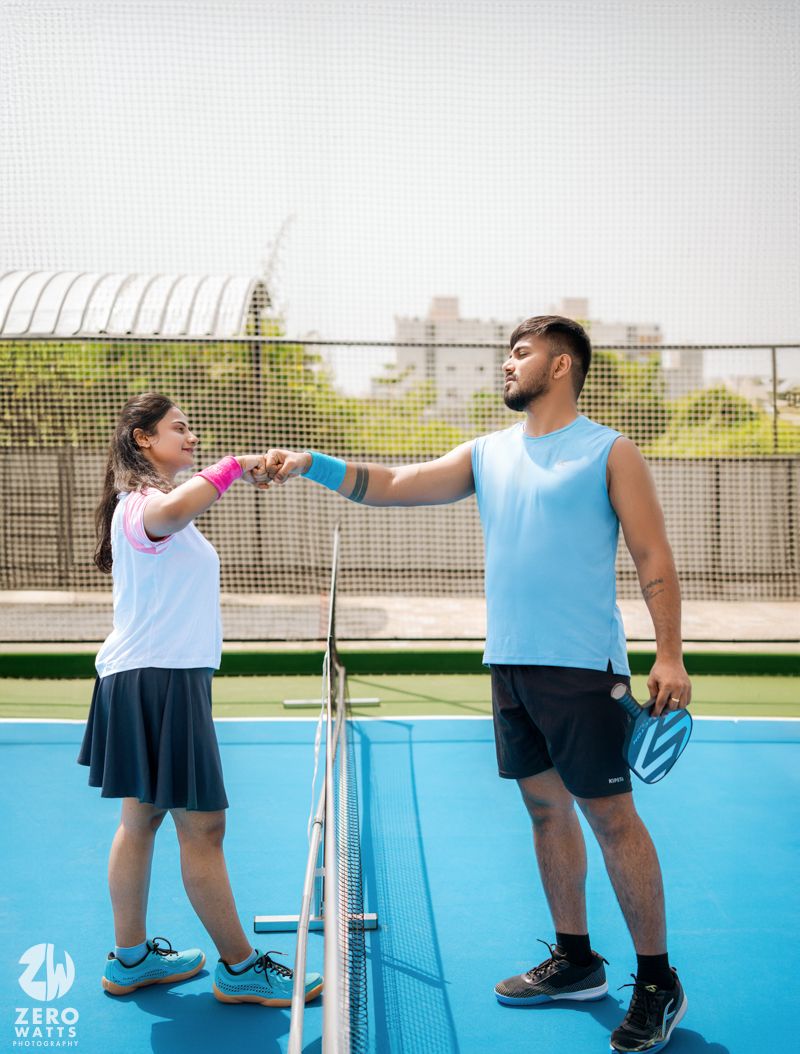 Athletes engaging in recreational activity on an outdoor sports court.