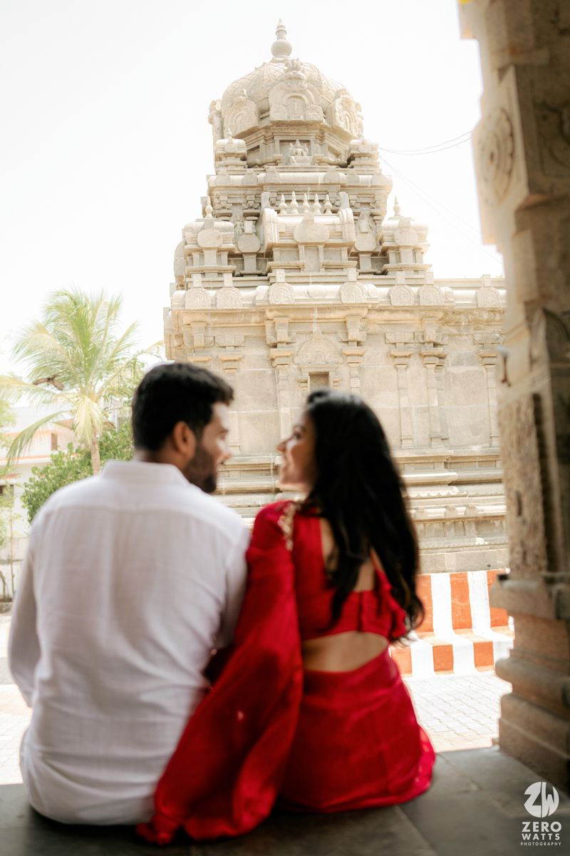 Dreamy couple photography showcasing tender moments against historic Indian temple architecture.