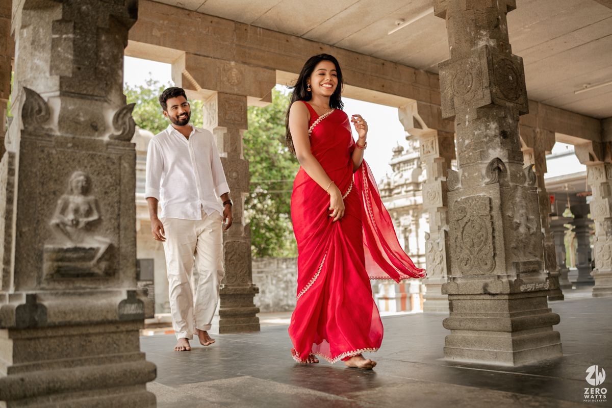 Traditional architectural corridor with stone pillars serving as backdrop for romantic photographs.