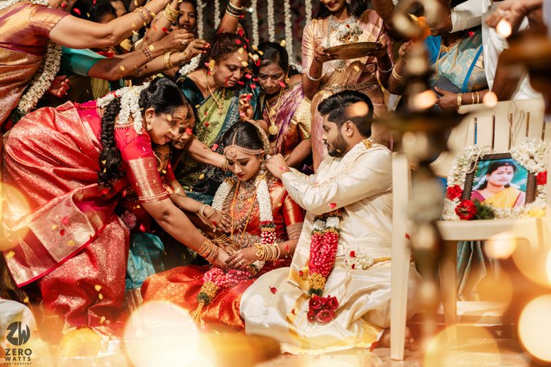 Traditional Indian wedding ceremony featuring colorful attire, rituals, and ceremonial decorations during an intimate gathering.