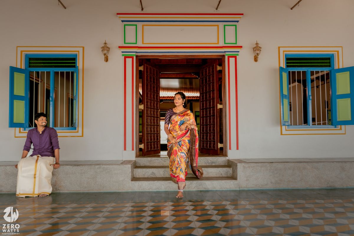 Colorful traditional building entrance with turquoise windows and decorative doorway.
