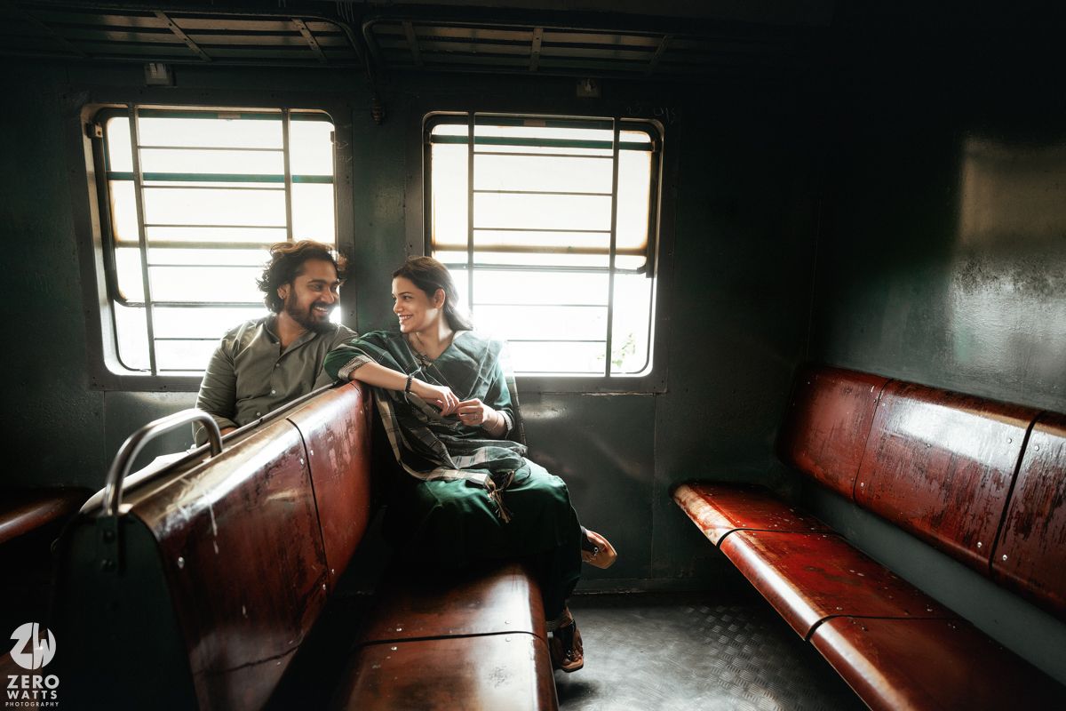 Dark and moody train interior scenes with red wooden benches and window light.