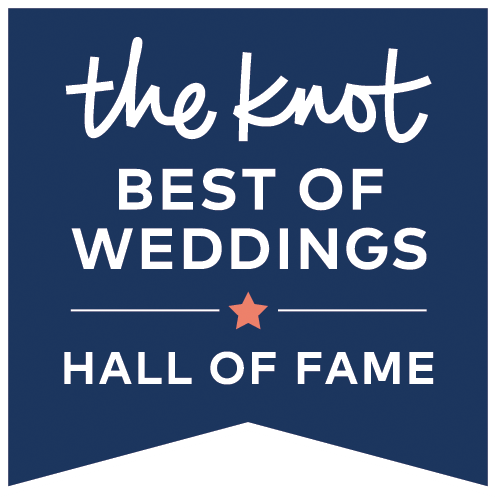 Navy blue banner logo for The Knot Best of Weddings Hall of Fame award with white text and coral star accent.