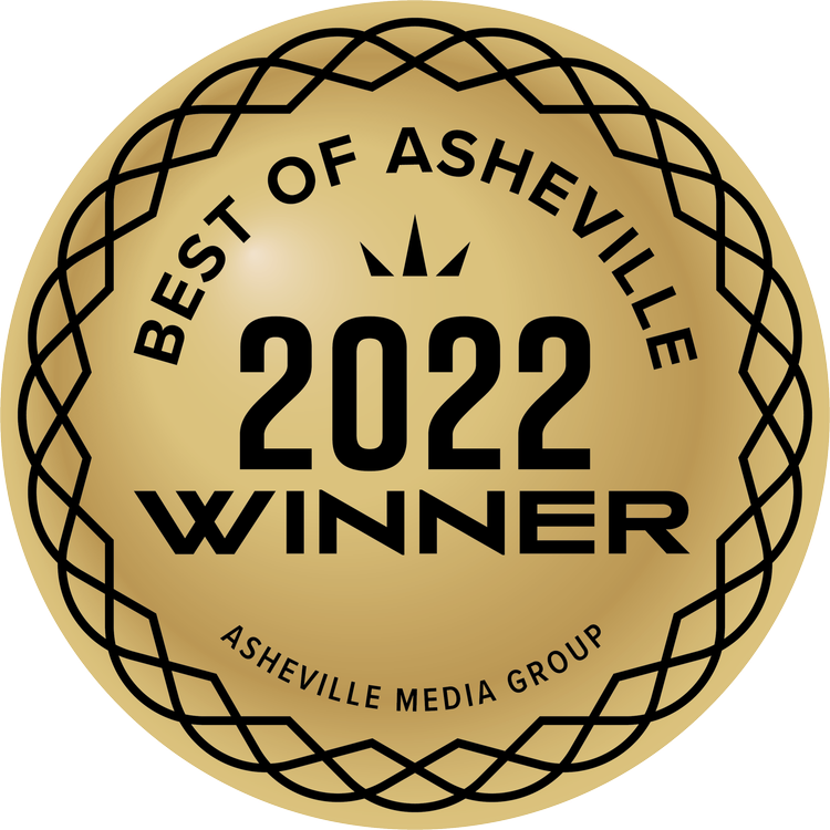 Gold circular badge with decorative border showing Best of Asheville 2022 Winner from Asheville Media Group.