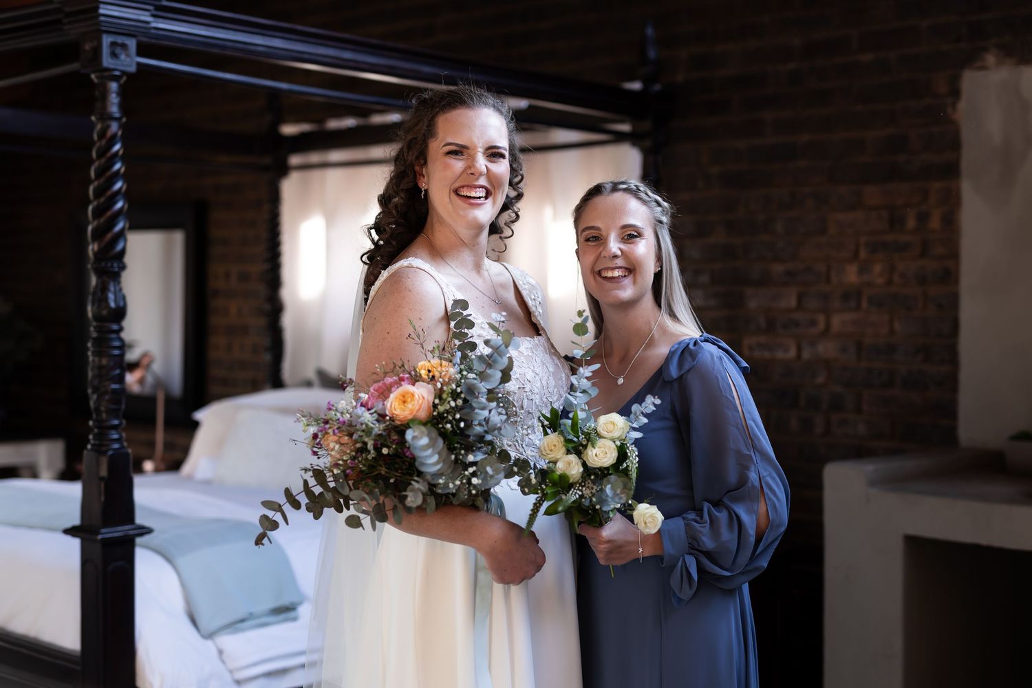 Bride and groom share intimate moments together in a rustic brick venue with natural lighting.