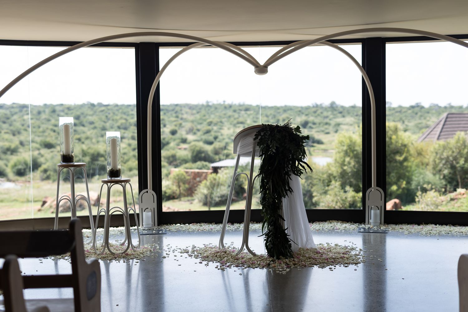 Elegant wedding venue balcony overlooking scenic natural landscape.