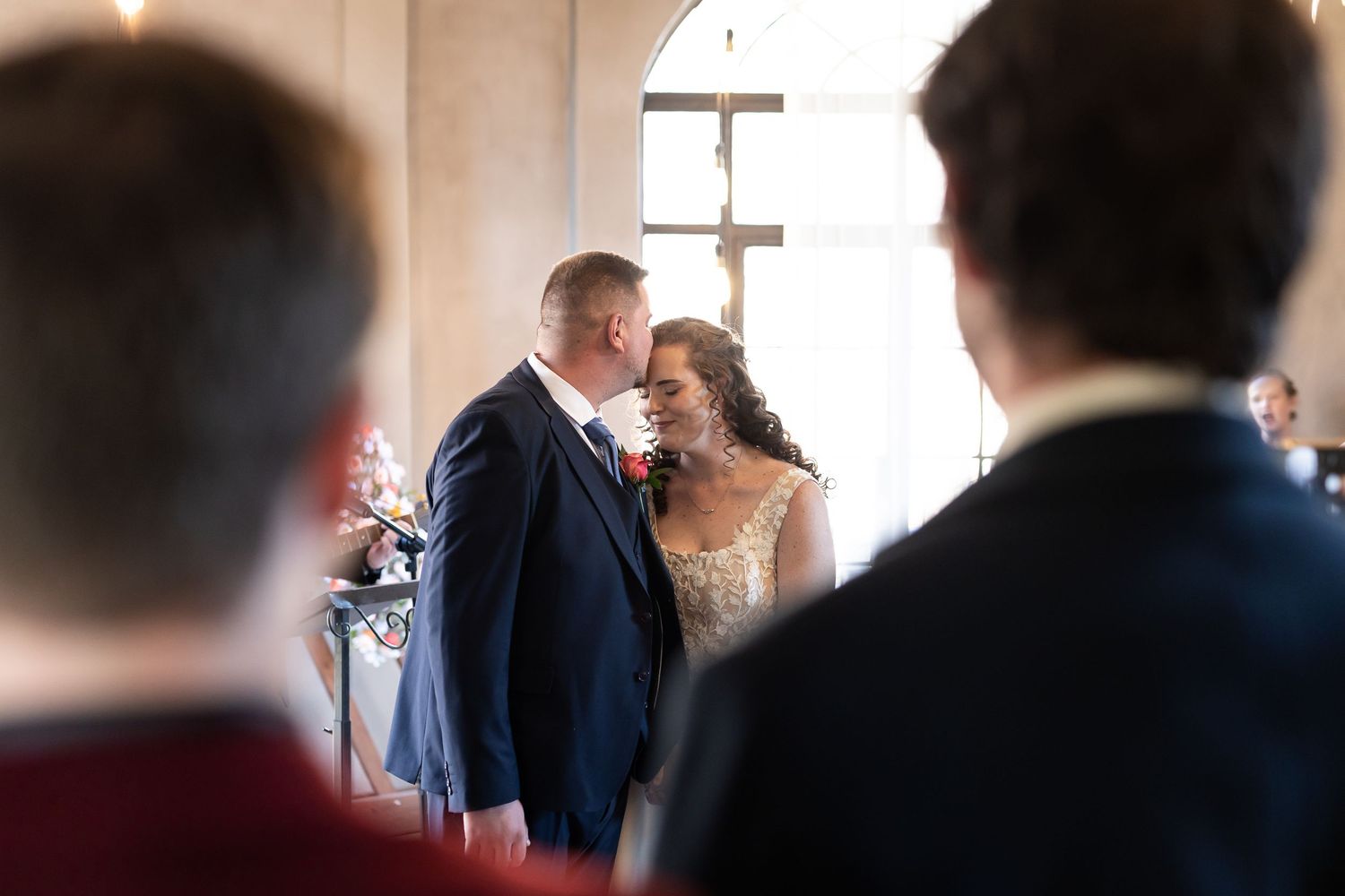 A sequence showing guests mingling in a bright indoor space at an elegant social gathering.