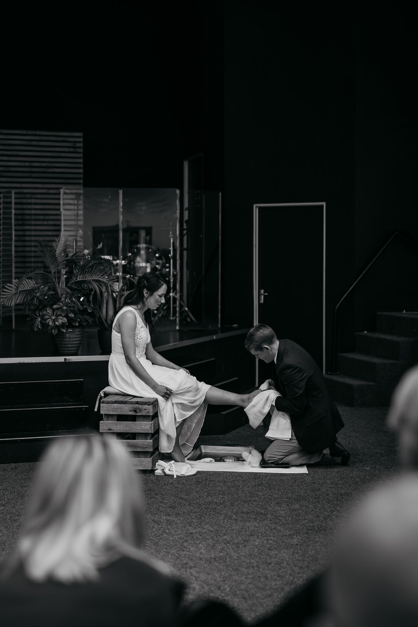 A sequence of monochrome images showing couples lying down in a dimly lit room.