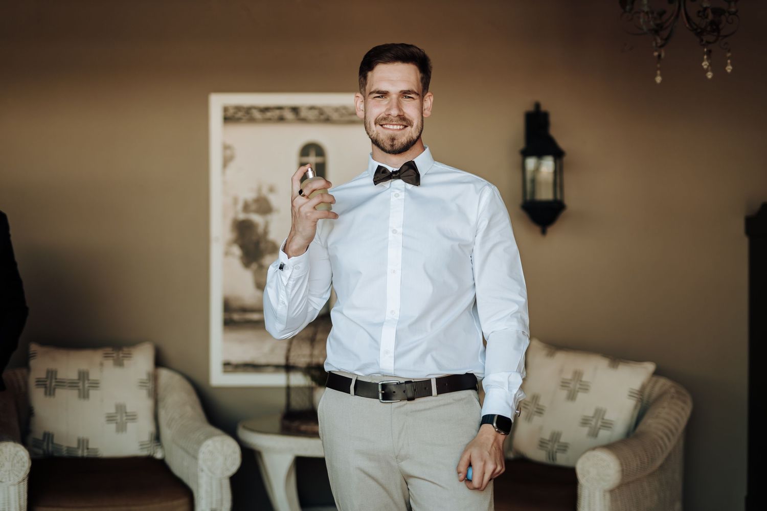 Sharp formal attire complete with bow tie and white shirt in an elegant setting.