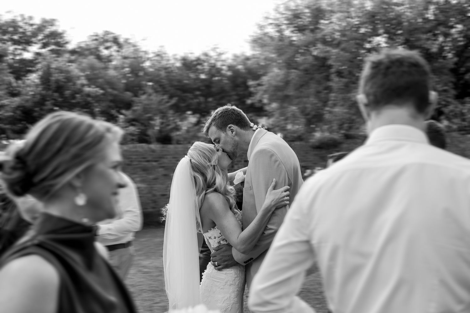 Black and white emotional moment during outdoor wedding ceremony.